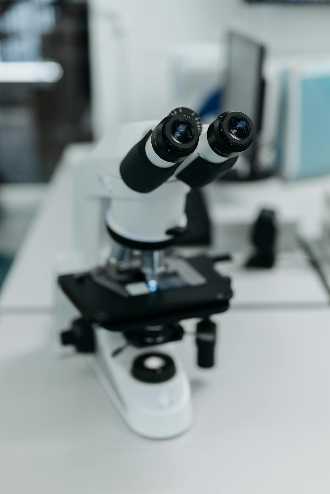 Focused view of a microscope in a modern laboratory setting, highlighting technology in scientific research.
